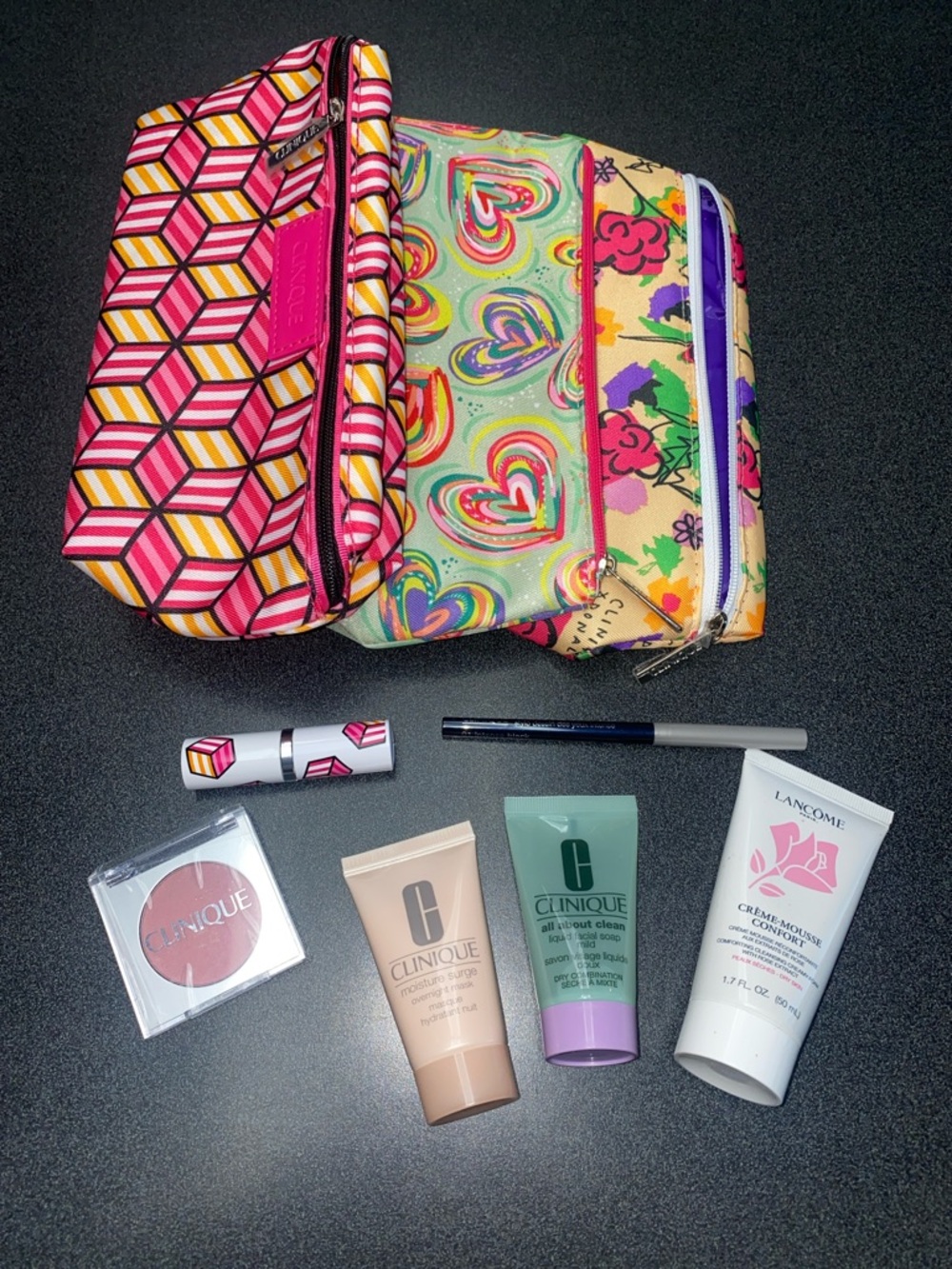 Lot of make up and make up bags.